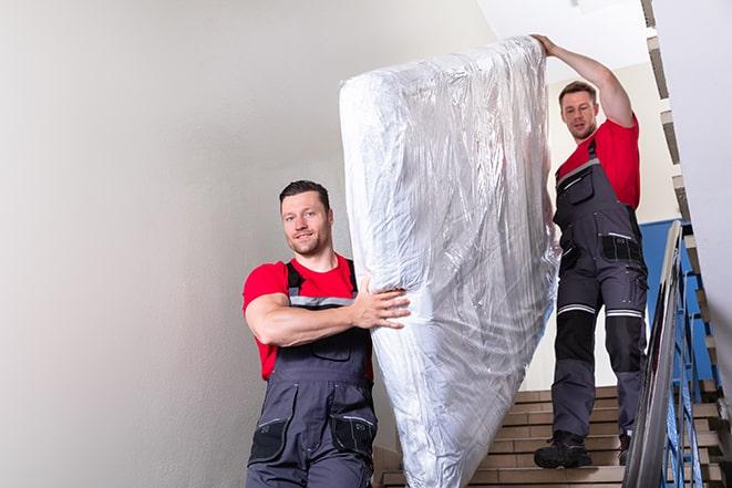 hauling away a worn-out box spring in Rio Rico